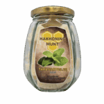 Bio-honing munt in een glazen pot, gedroogde honing munt met verse kruiden, bekend om zijn aromatische en medicinale eigenschappen, ideaal voor thee en recepten.